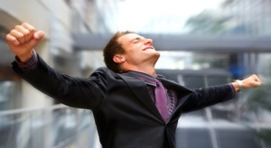 Excited man with arms stretched out